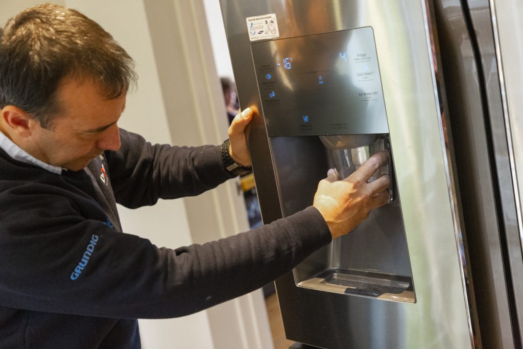 Domex engineer checking ice maker is working